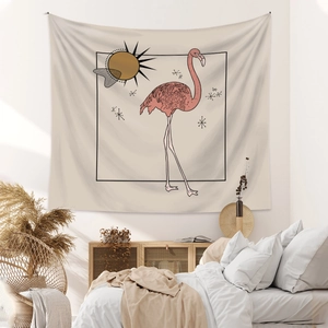 Detail of bohemian flamingo tapestry with golden sun and geometric patterns on wall