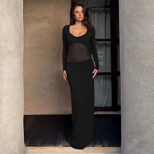 Detail of elegant black slim fit dress featuring sheer mesh patchwork at the waistline