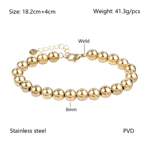 Detail of 8mm gold beads bracelet in polished stainless steel with lobster clasp