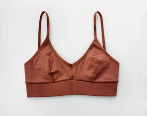 Detailed close-up of ribbed cotton sports bra with deep V-neck and thin shoulder straps