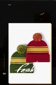 Close-up of thick knit pom-pom hats with yellow stripes in dark green and burgundy