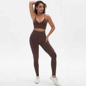 Detail view of seamless chocolate brown V-neck sports bra and high waist yoga leggings set