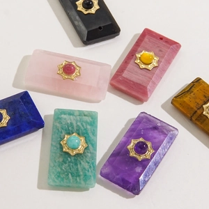 Faceted natural stone rectangular tarot pendants with golden metal settings in multiple colors