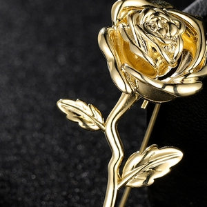 Elegant gold rose flower brooch for suits and coats with polished leaves and stem
