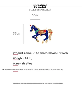 Detail of blue enamel carousel horse brooch showing alloy texture and 5.5cm x 3.3cm dimensions