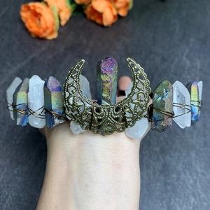 Detail of handcrafted bridal tiara with colorful raw crystals and hollow moon metal piece