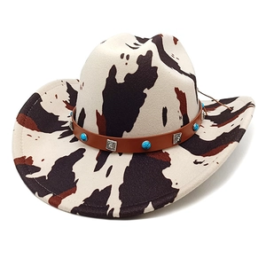 Classic cow print western cowboy hat featuring turquoise stones and silver stud trim