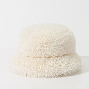 Detailed close-up of cream-white faux fur bucket hat showing soft fluffy plush texture