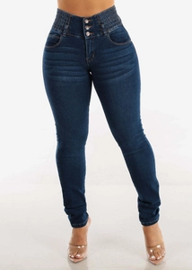 Detail of high waist stretch skinny jeans in dark blue with triple button closure