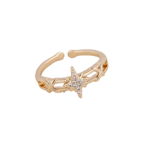 Adjustable gold plated copper ring with zircon star and eye charms on white background