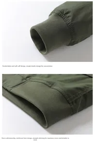Detail showing elastic ribbed cuffs and reinforced hem of olive flight jacket