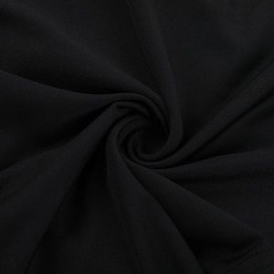 Macro shot of high-elastic black knitted fabric texture for a slim-fit backless dress