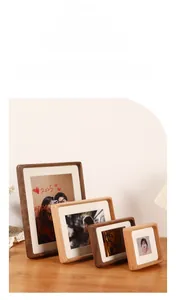 Close-up of walnut wood photo frames with rounded corners and mortise-tenon joints