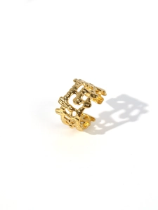 Macro detail of 18k gold plated stainless steel ring with lava textured hollow design