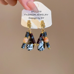 Close-up of ethnic style drop earring with S925 silver needle and natural dalmatian stone