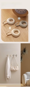 Detail of multi-color adhesive hooks for kitchen and bathroom wall storage