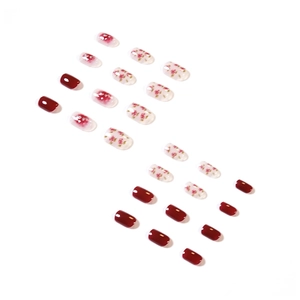 Short round press-on nails with dark rose red, floral patterns and glitter finish