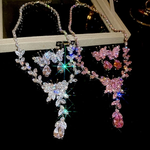 Detailed view of luxury butterfly tassel jewelry sets in silver and pink crystal finish