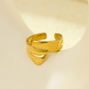 Macro view of 18K gold-plated irregular lava texture open ring with metallic luster