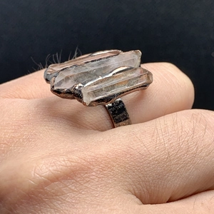 Vintage bronze open ring featuring three raw white crystal hexagonal pillars in rustic style