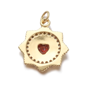 Golden octagonal star pendant with a red heart-shaped gemstone on a white background