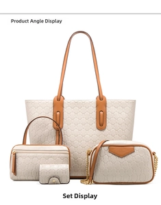 Close-up of a 4-piece cream tote bag set with textured leather and brown trim details