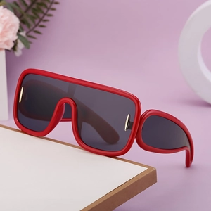 Red oversized shield sunglasses for cycling with gray lenses and golden accents