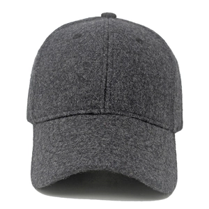 Detailed front view of dark gray wool baseball cap showing thick warm winter texture