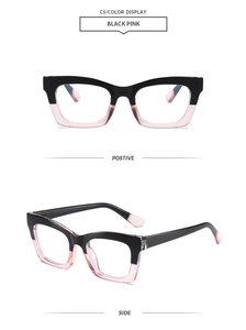 Detail view of square black and pink frames with clear blue light blocking lenses