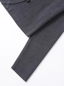 Close-up of charcoal gray knit fabric texture on stylish women's trousers