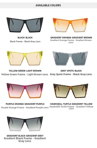 Flat lay of oversized cat-eye sunglasses in seven trendy colors with flat top frames