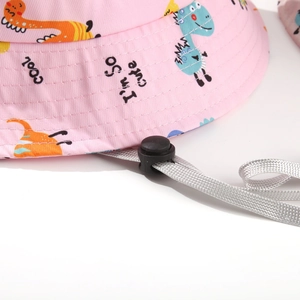 Detail of pink kids bucket hat showing dinosaur prints and adjustable windproof rope