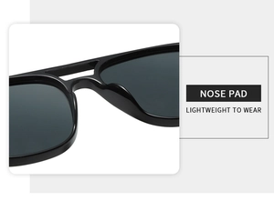 Detail of integrated black nose pads on lightweight vintage square sunglasses frames