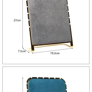 Detailed view of jewelry display stands with gray and cyan velvet boards and gold metal frames