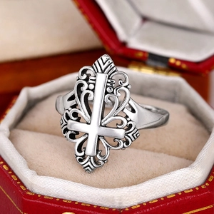 Retro Gothic silver ring with inverted cross design and ornate cutout wave patterns