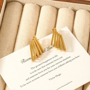 Unique geometric gold-tone bar earrings displayed on an elegant white jewelry card