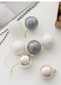 Detailed view of mixed finish Christmas ornaments with glitter and metallic coating