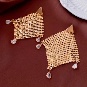 Detailed shot of golden mesh diamond earrings with zircon teardrop pendants