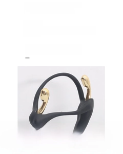 Close-up of black matte resin and golden electroplated abstract sculpture details
