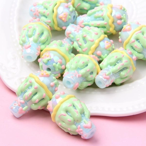 Macro shot of colorful DIY ice cream cone resin beads with light blue and green details