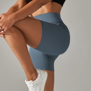 Close-up of high-waisted yoga shorts in mist blue showing elastic fabric and compression fit