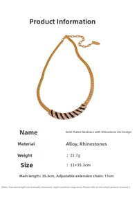 Detail of gold plated necklace showing sparkling rhinestones and black oil drip design