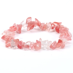 Detailed macro view of irregular natural pink quartz crystal elastic stretch bracelet