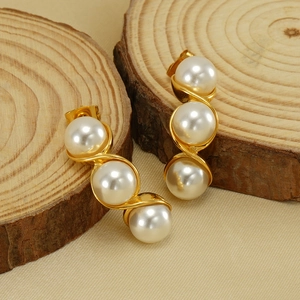 Gold wavy stainless steel drop earrings with three white pearls on wood slices