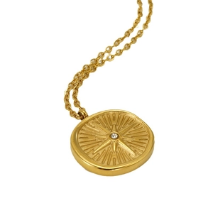 18k gold-plated stainless steel necklace with a diamond-set starburst pendant charm