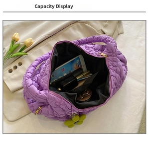 Inside view of purple quilted cloud tote bag showing spacious capacity for daily essentials