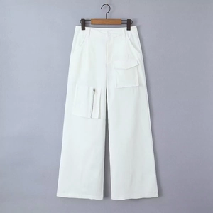 Detail view of white wide-leg cargo pants with metallic zipper and utility pocket