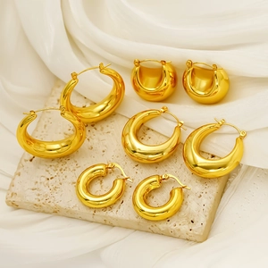 Set of four sizes 18K gold plated hollow crescent hoop earrings on stone display