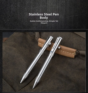 Detail view of two stainless steel tactical pens with bolt action on brown canvas
