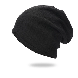 Classic black ribbed knit slouchy beanie hat featuring a soft vertical textured stripe design